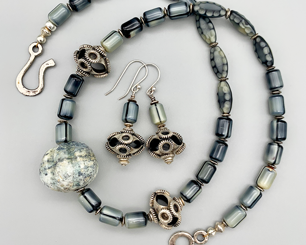 Necklace Set | Carved gray focal stone, gray vintage glass beads,"flying saucer" Bali beads