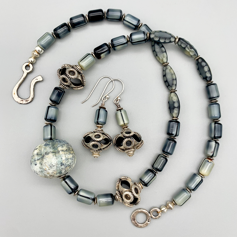 Necklace Set | Carved gray focal stone, gray vintage glass beads,"flying saucer" Bali beads