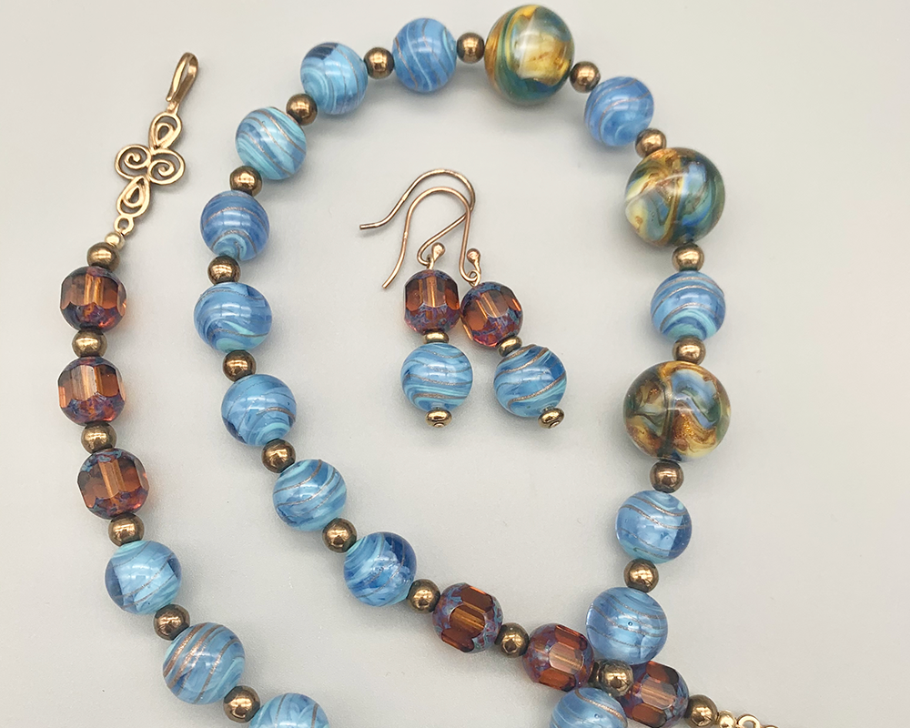 Necklace Set | Cherry Brand blue/gold givre rounds, German marbled lampwork
