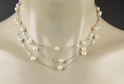 Long delicate sterling silver and pearl necklace, the necklace is 50 inches longwith a sterling silver magnetic clasp closure