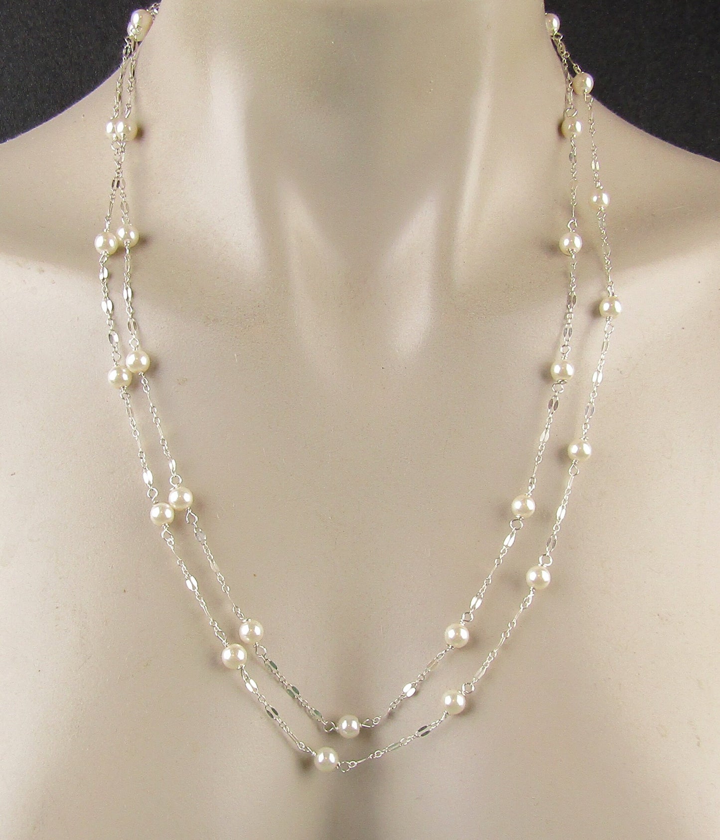 Long delicate sterling silver and pearl necklace, the necklace is 50 inches longwith a sterling silver magnetic clasp closure